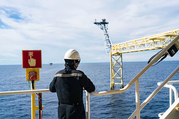 Man on a ship, looking over the sea